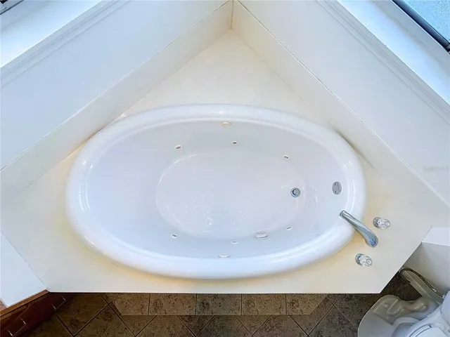 a bathroom with a toilet a sink a mirror and vanity