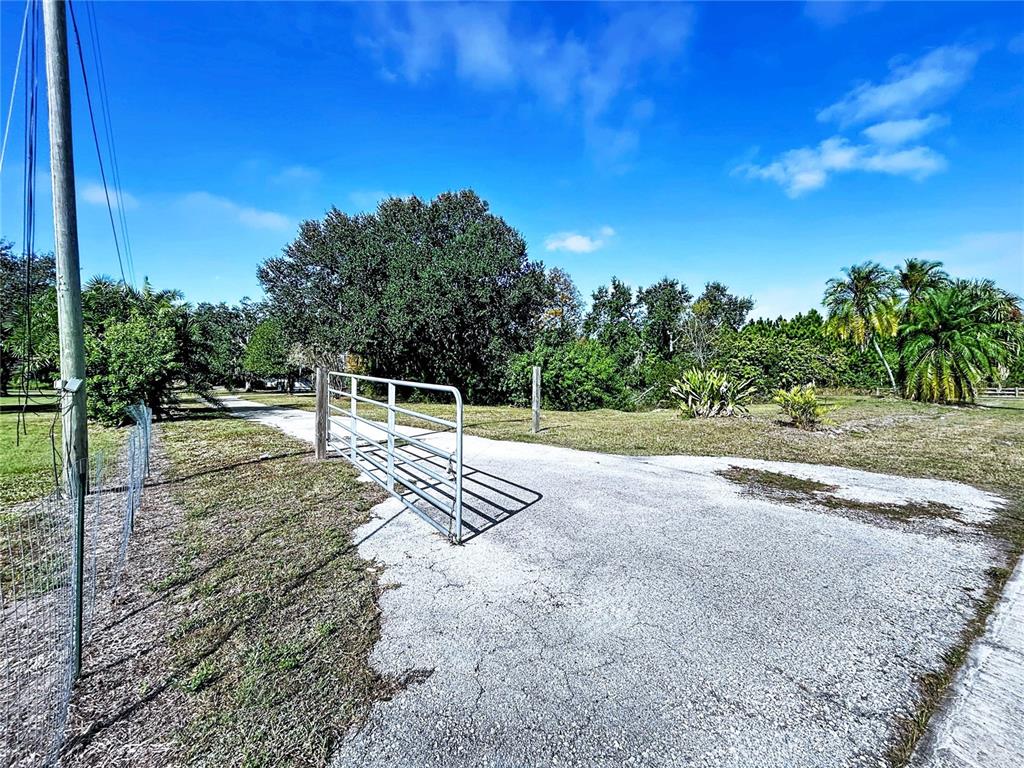 4103 North Rye Road Parrish, FL 34219 - Photo 3 of 40 a view of a yard with iron fence