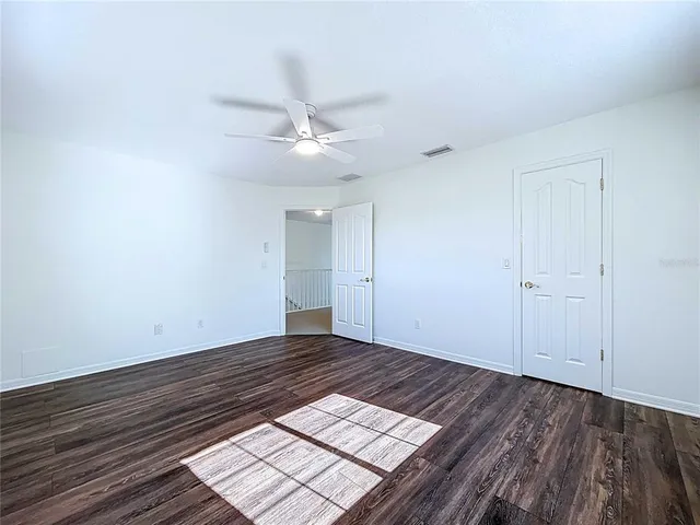 a view of a house with swimming pool and sitting area