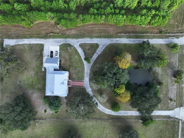 an aerial view of residential house with outdoor space