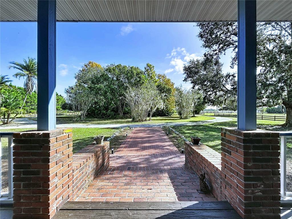 4103 North Rye Road Parrish, FL 34219 - Photo 7 of 40 a view of a yard with plants and a bench