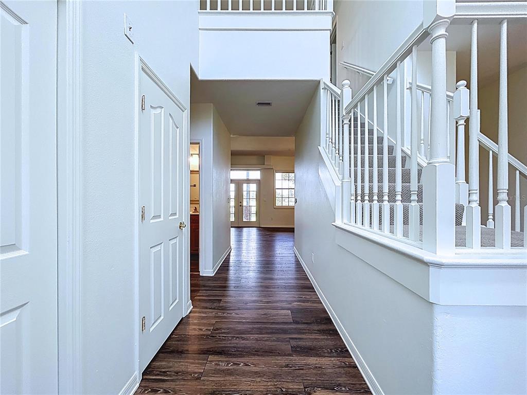 4103 North Rye Road Parrish, FL 34219 - Photo 8 of 40 a view of a hallway with wooden floor and staircase