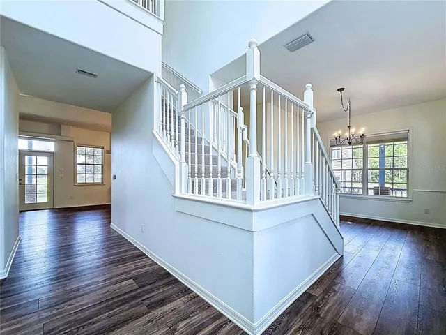 a view of an entryway with wooden floor