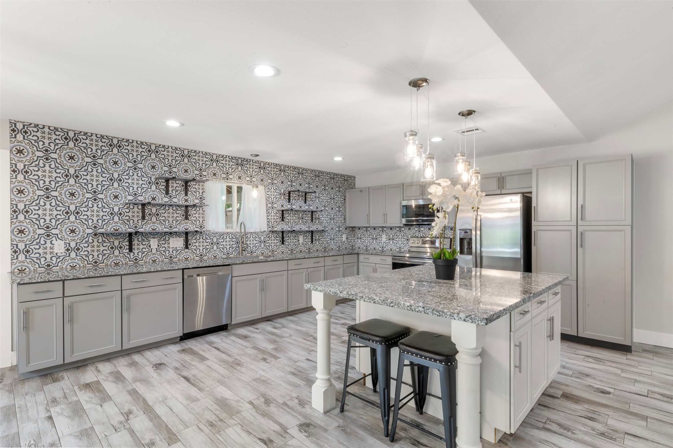 15151 Robin Trail Conroe, TX 77302 - Photo 17 of 50 Open shelving on one wall of the kitchen