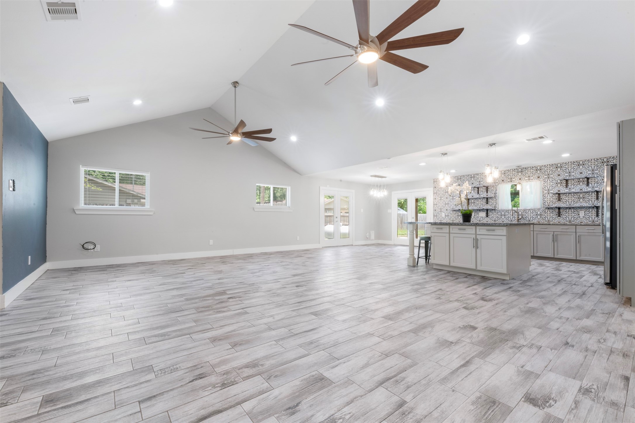 15151 Robin Trail Conroe, TX 77302 - Photo 9 of 50 Large open-concept living and kitchen area with island