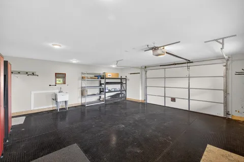 a view of a livingroom with furniture and a ceiling fan
