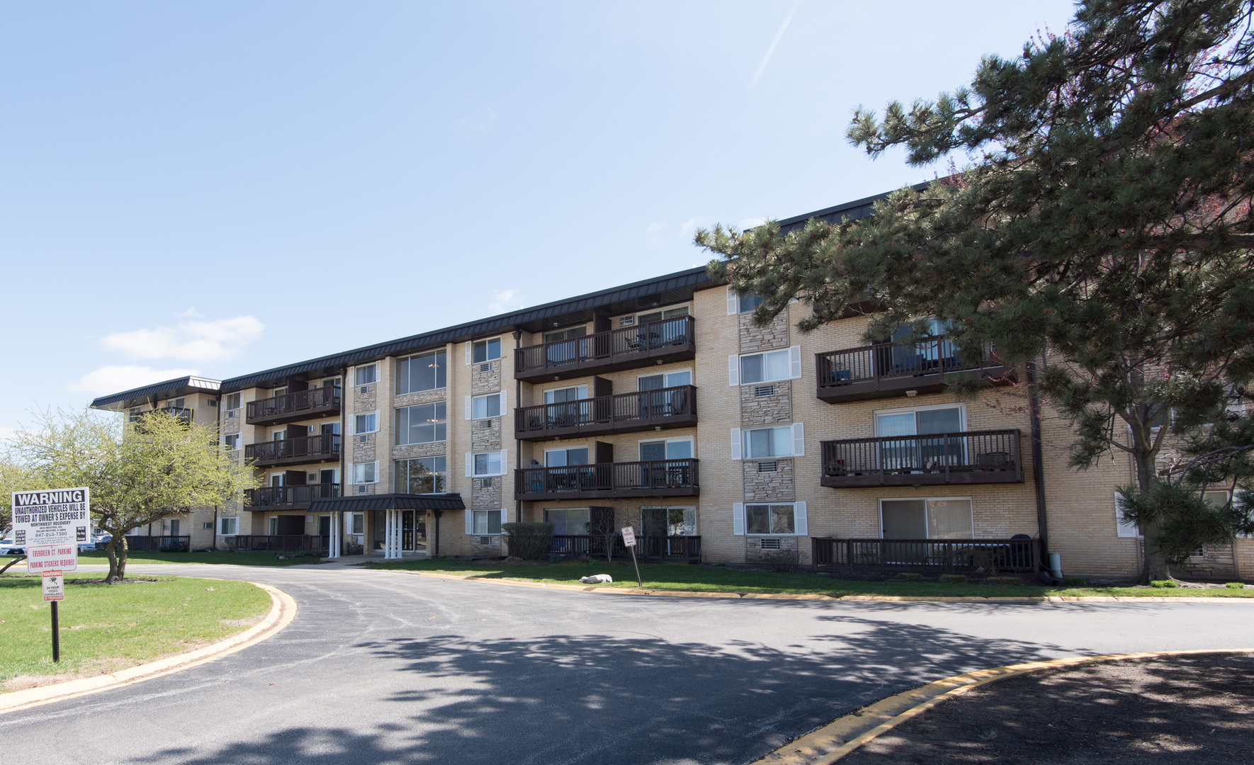 2218 South Goebbert Road, Unit 487 Arlington Heights, IL 60005 - Photo 1 of 23 a view of a building with a swimming pool