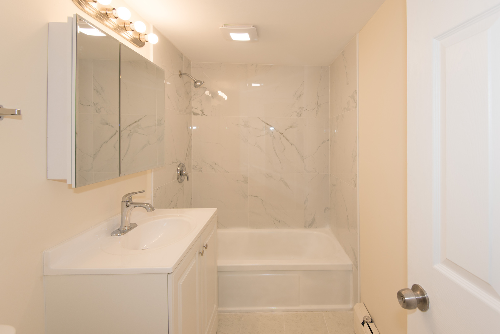 2218 South Goebbert Road, Unit 487 Arlington Heights, IL 60005 - Photo 15 of 23 a bathroom with a sink a toilet and shower