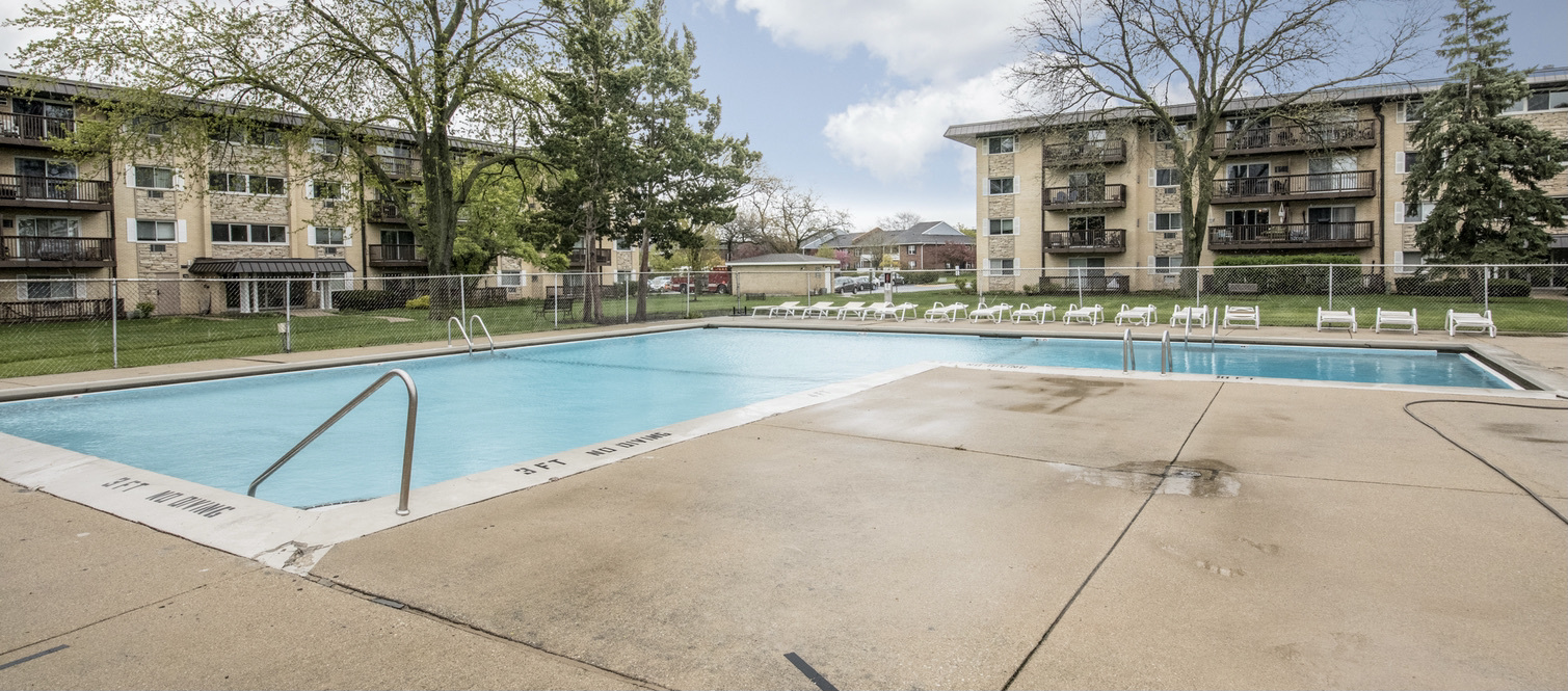 2218 South Goebbert Road, Unit 487 Arlington Heights, IL 60005 - Photo 23 of 23 a view of swimming pool with outdoor seating and city view