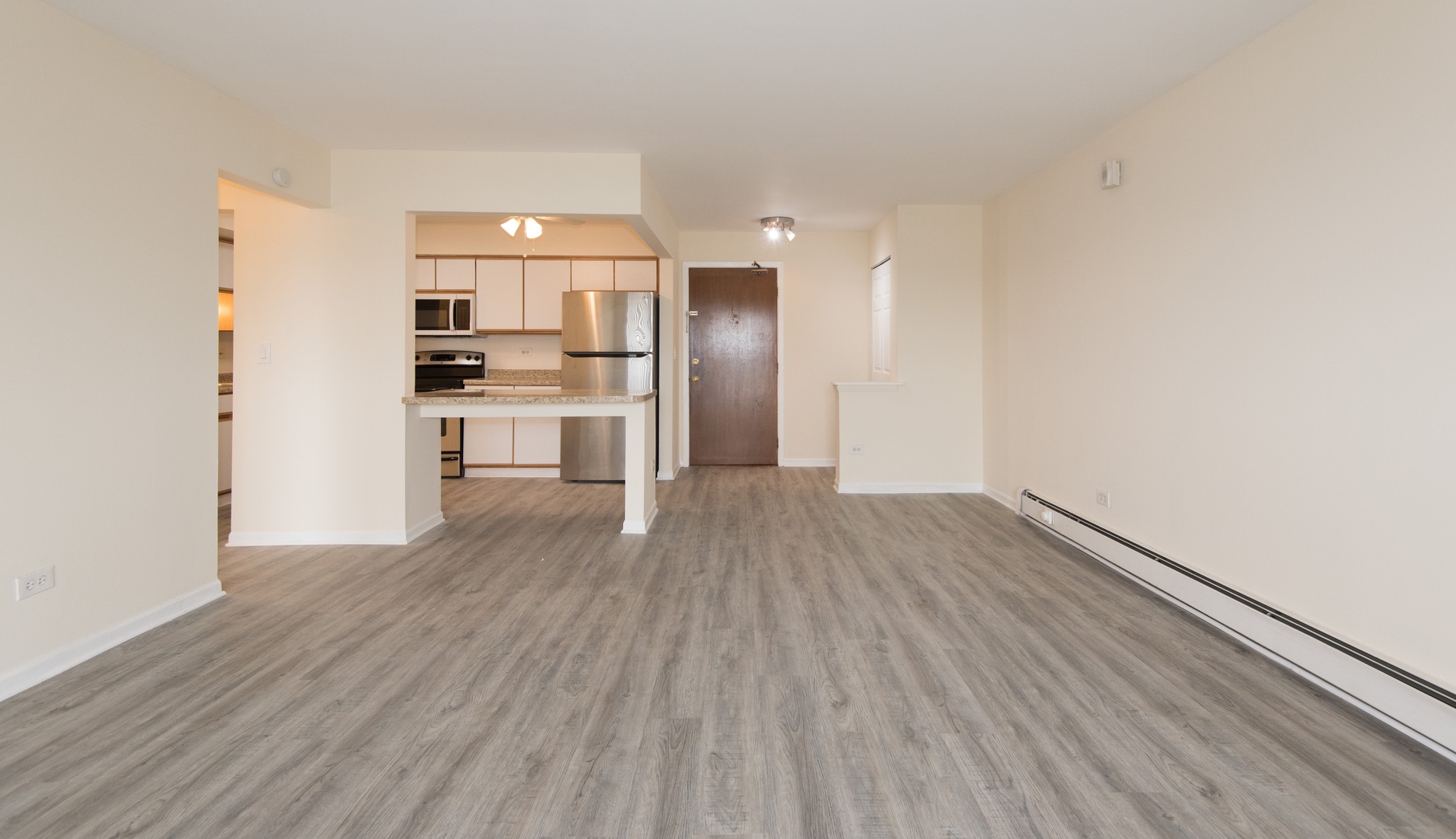 2218 South Goebbert Road, Unit 487 Arlington Heights, IL 60005 - Photo 6 of 23 a view of a kitchen from the hallway