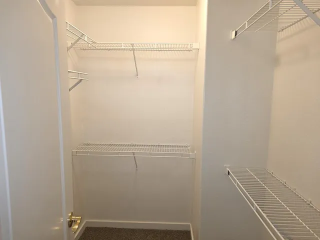 a view of small space with racks on the wall