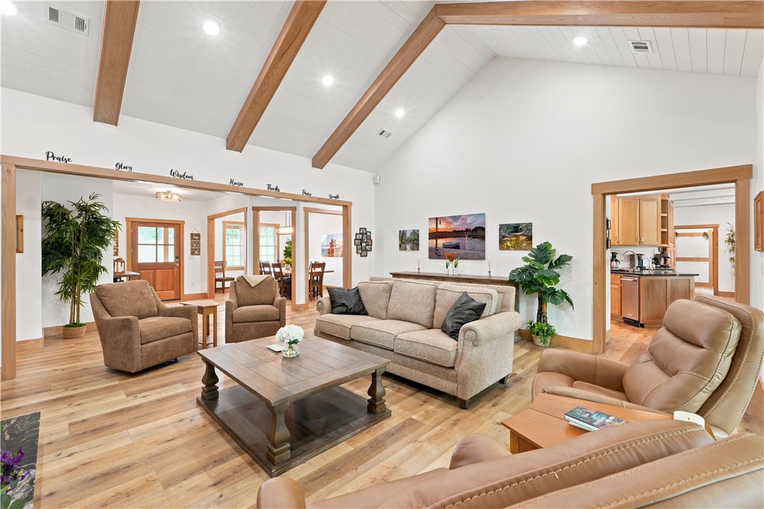 8800 Fred Austin Road Decatur, AR 72722 - Photo 6 of 60 Vaulted ceiling with wood beams, pocket door leading into the kitchen so the room can be closed off