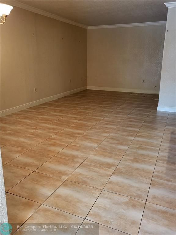 780 Northeast 199th Street, Unit E 101 Miami, FL 33179 - Photo 11 of 34 a view of room with window