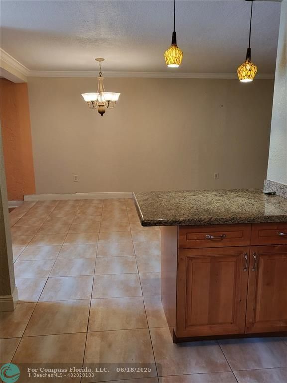 780 Northeast 199th Street, Unit E 101 Miami, FL 33179 - Photo 12 of 34 a view of a kitchen with a sink