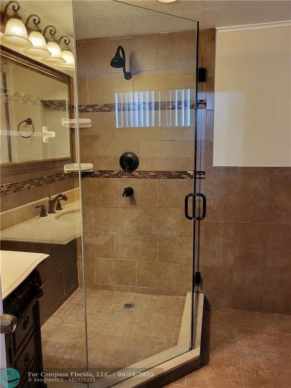 780 Northeast 199th Street, Unit E 101 Miami, FL 33179 - Photo 14 of 34 a bathroom with a shower