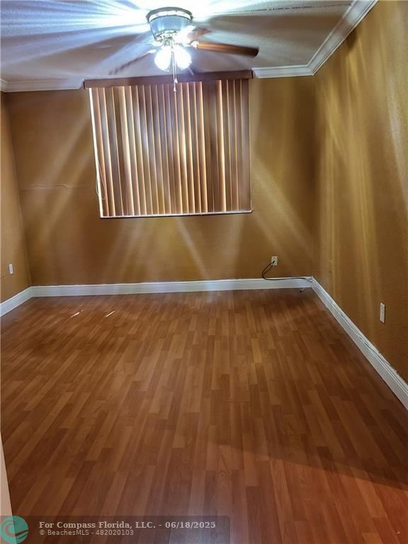 780 Northeast 199th Street, Unit E 101 Miami, FL 33179 - Photo 17 of 34 wooden floor in an empty room