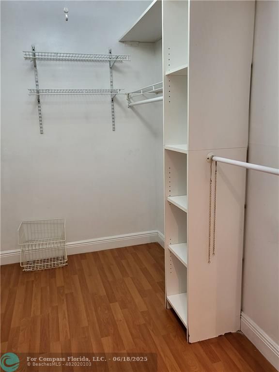 780 Northeast 199th Street, Unit E 101 Miami, FL 33179 - Photo 20 of 34 a view of an empty walk in closet