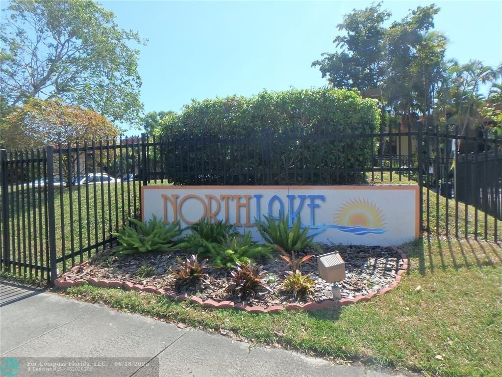 780 Northeast 199th Street, Unit E 101 Miami, FL 33179 - Photo 2 of 34 a view of a garden with plants in front of it