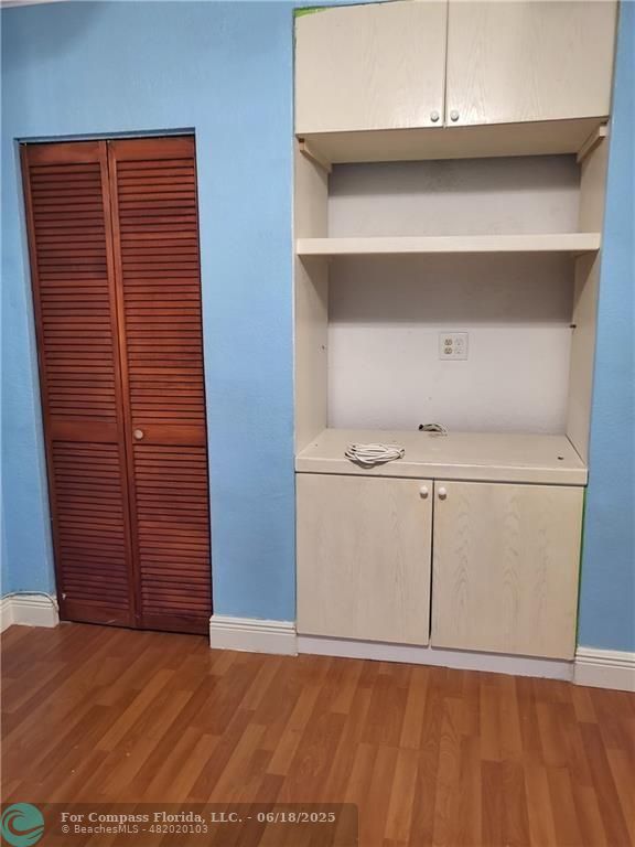 780 Northeast 199th Street, Unit E 101 Miami, FL 33179 - Photo 22 of 34 a view of an empty room with closet