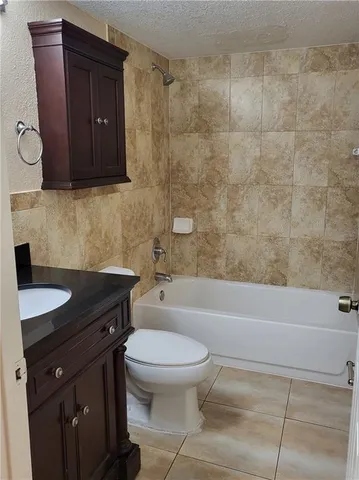 a bathroom with a sink a toilet and bathtub