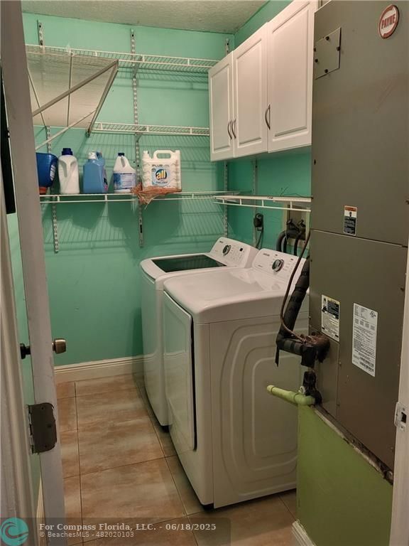 780 Northeast 199th Street, Unit E 101 Miami, FL 33179 - Photo 24 of 34 a utility room with a washing machine and a sink