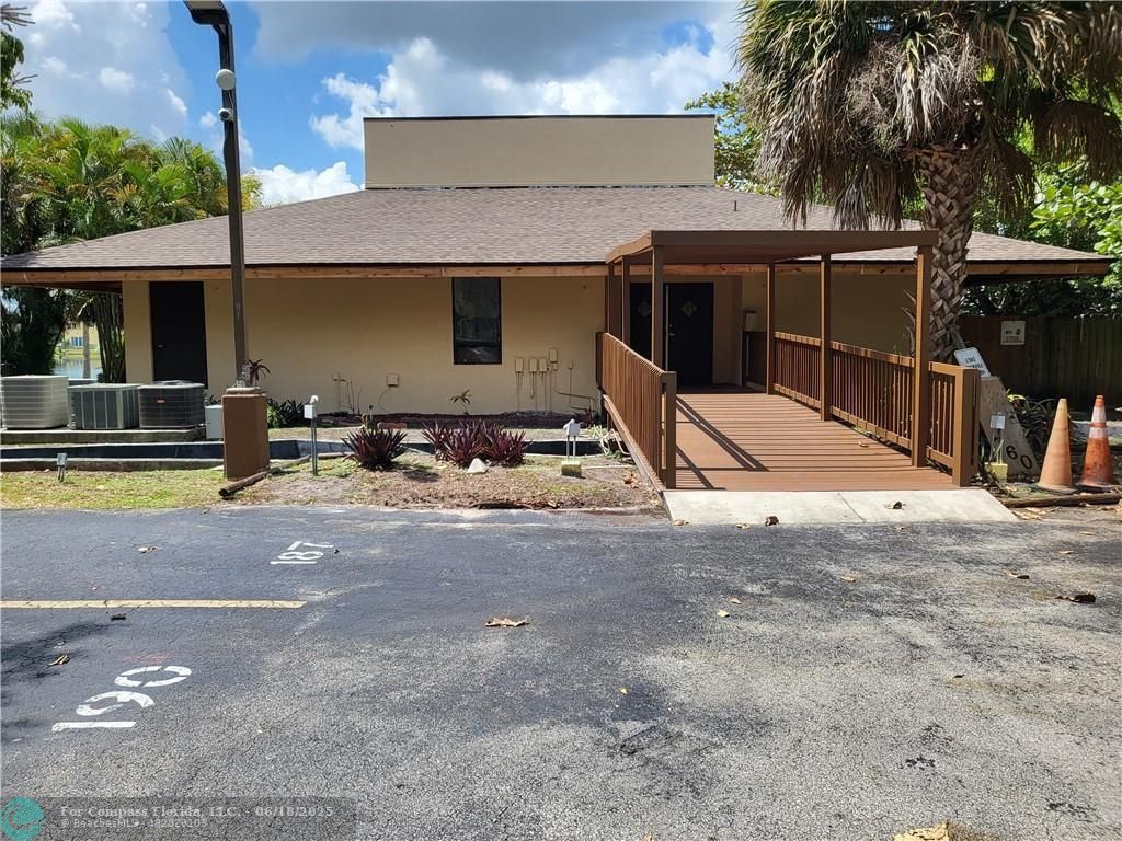 780 Northeast 199th Street, Unit E 101 Miami, FL 33179 - Photo 28 of 34 a view of a house with backyard space and a area