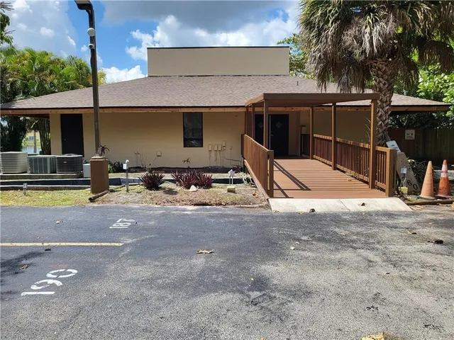 a view of a street with a bench