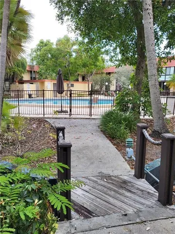 a view of a park with large trees