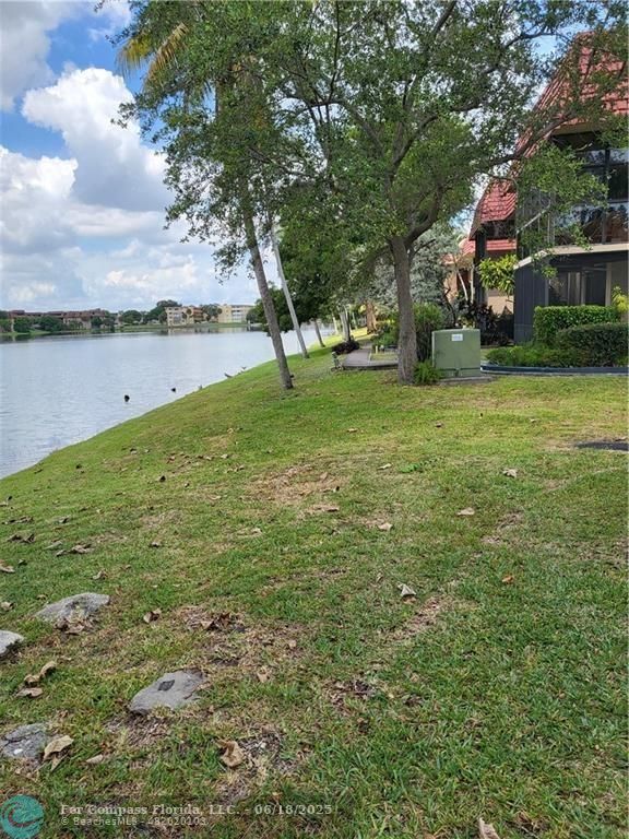 780 Northeast 199th Street, Unit E 101 Miami, FL 33179 - Photo 31 of 34 a view of a park with large trees