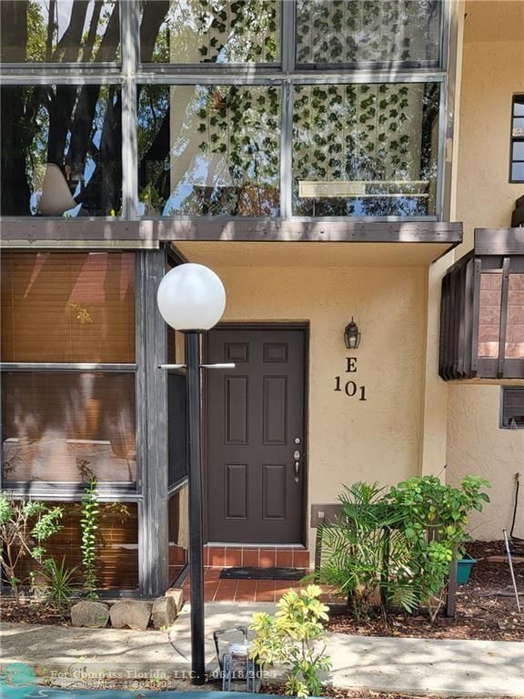 780 Northeast 199th Street, Unit E 101 Miami, FL 33179 - Photo 4 of 34 a front view of a house with street view