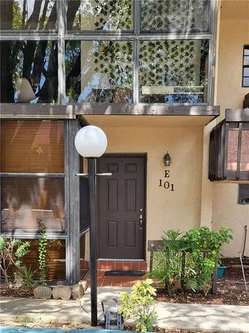 a front view of a house with street view
