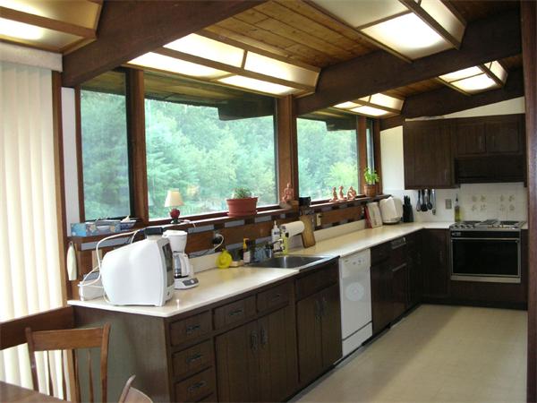 63 B Willow Road Boxford, MA 01921 - Photo 8 of 17 a kitchen with a sink and a large window