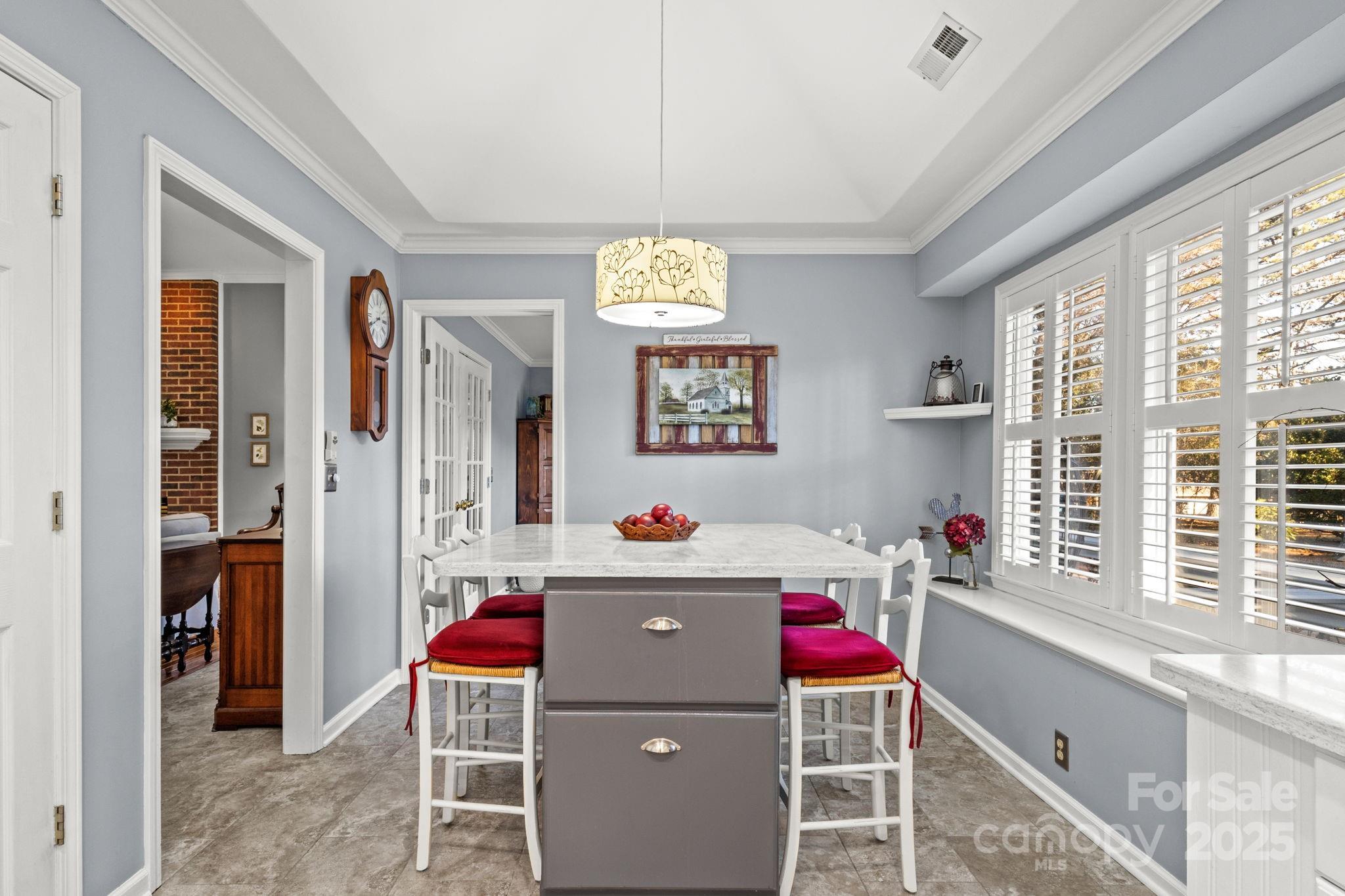 227 Point Wylie Lane Fort Mill, SC 29708 - Photo 13 of 36 a room with furniture a chandelier and a window
