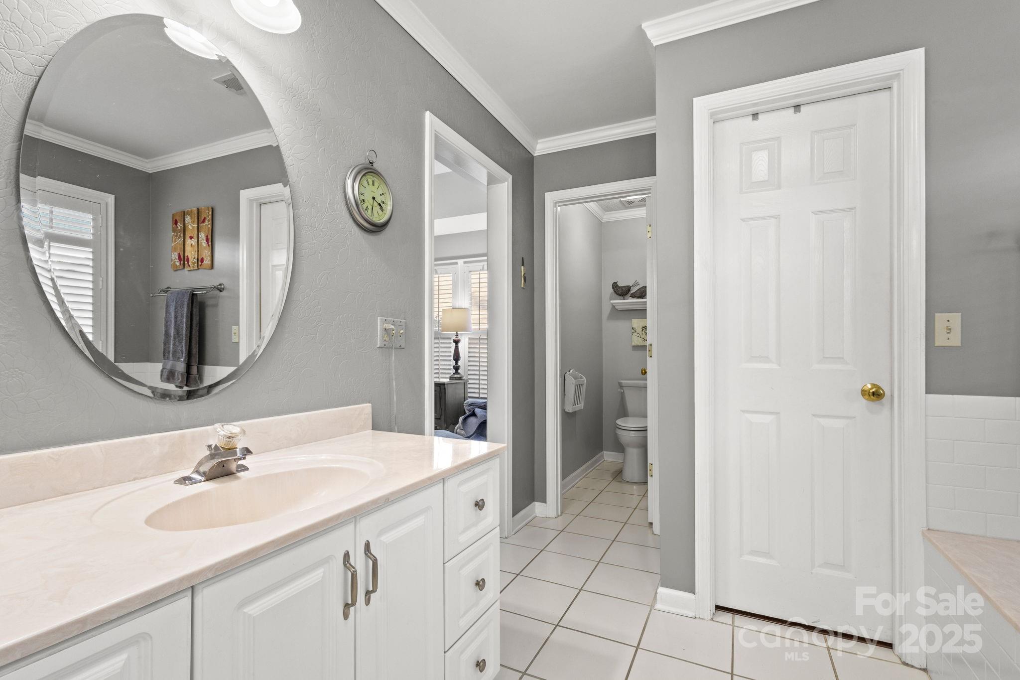 227 Point Wylie Lane Fort Mill, SC 29708 - Photo 20 of 36 a spacious bathroom with a sink a mirror and a shower