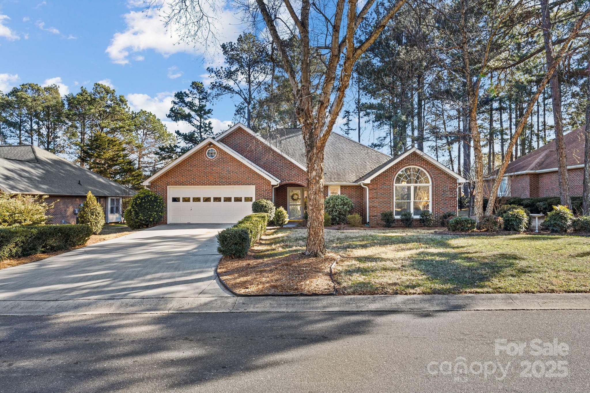 227 Point Wylie Lane Fort Mill, SC 29708 - Photo 2 of 36 a front view of a house with garden