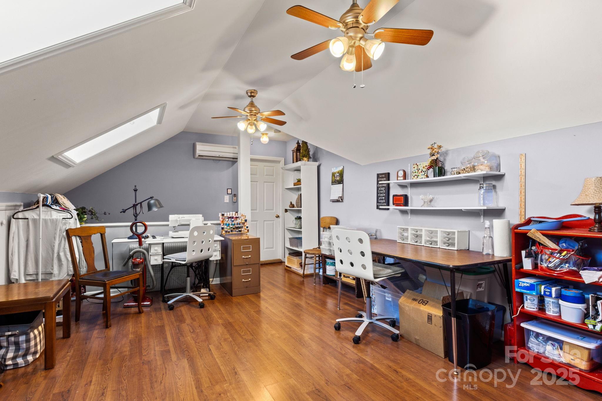 227 Point Wylie Lane Fort Mill, SC 29708 - Photo 22 of 36 a view of a workspace with furniture and wooden floor