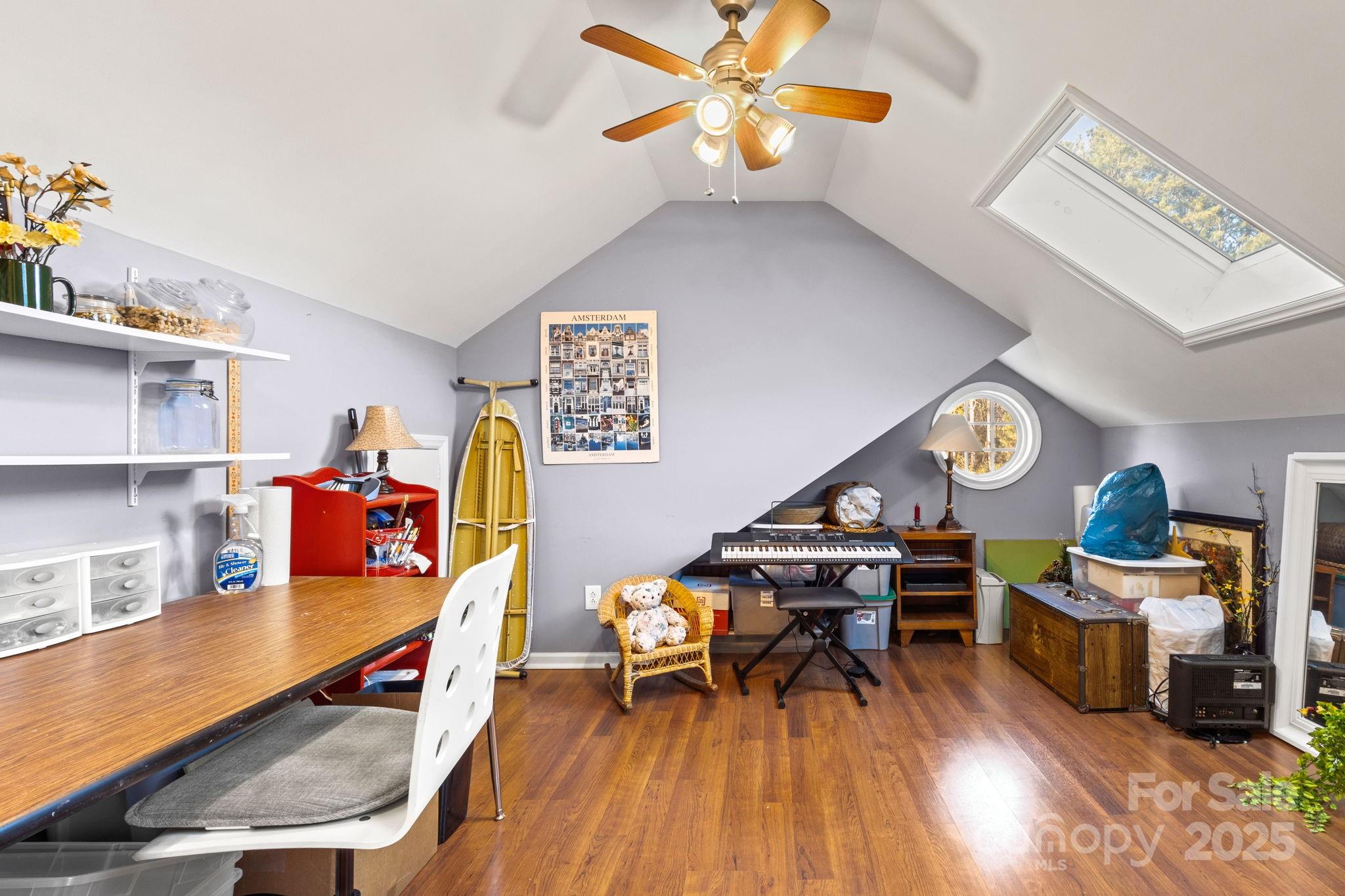 227 Point Wylie Lane Fort Mill, SC 29708 - Photo 23 of 36 a living room filled with furniture and a wooden floor