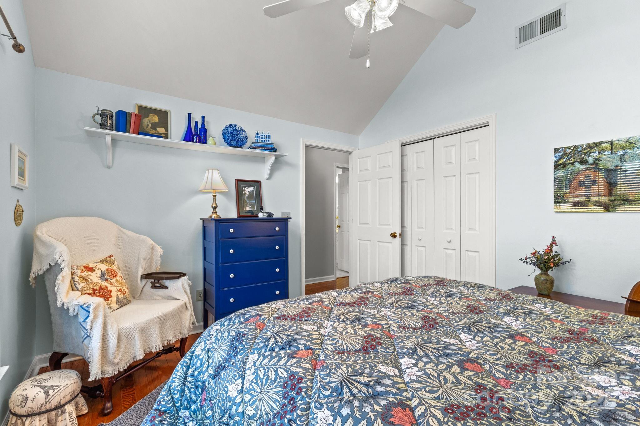 227 Point Wylie Lane Fort Mill, SC 29708 - Photo 25 of 36 a bedroom with a bed and wooden floor