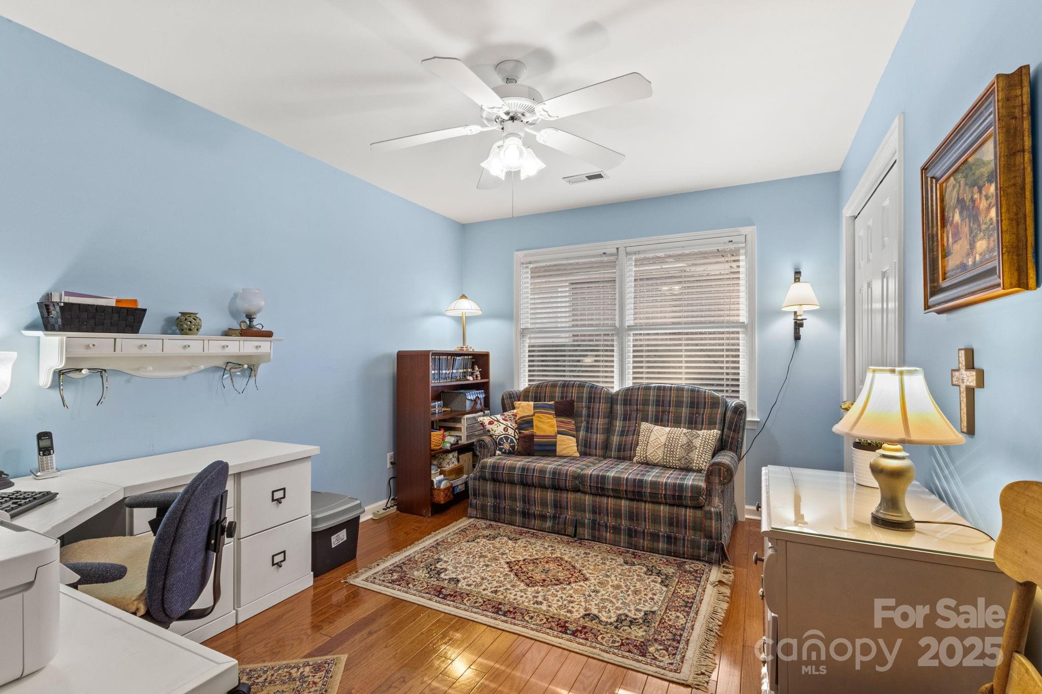 227 Point Wylie Lane Fort Mill, SC 29708 - Photo 26 of 36 a living room with furniture and a chandelier