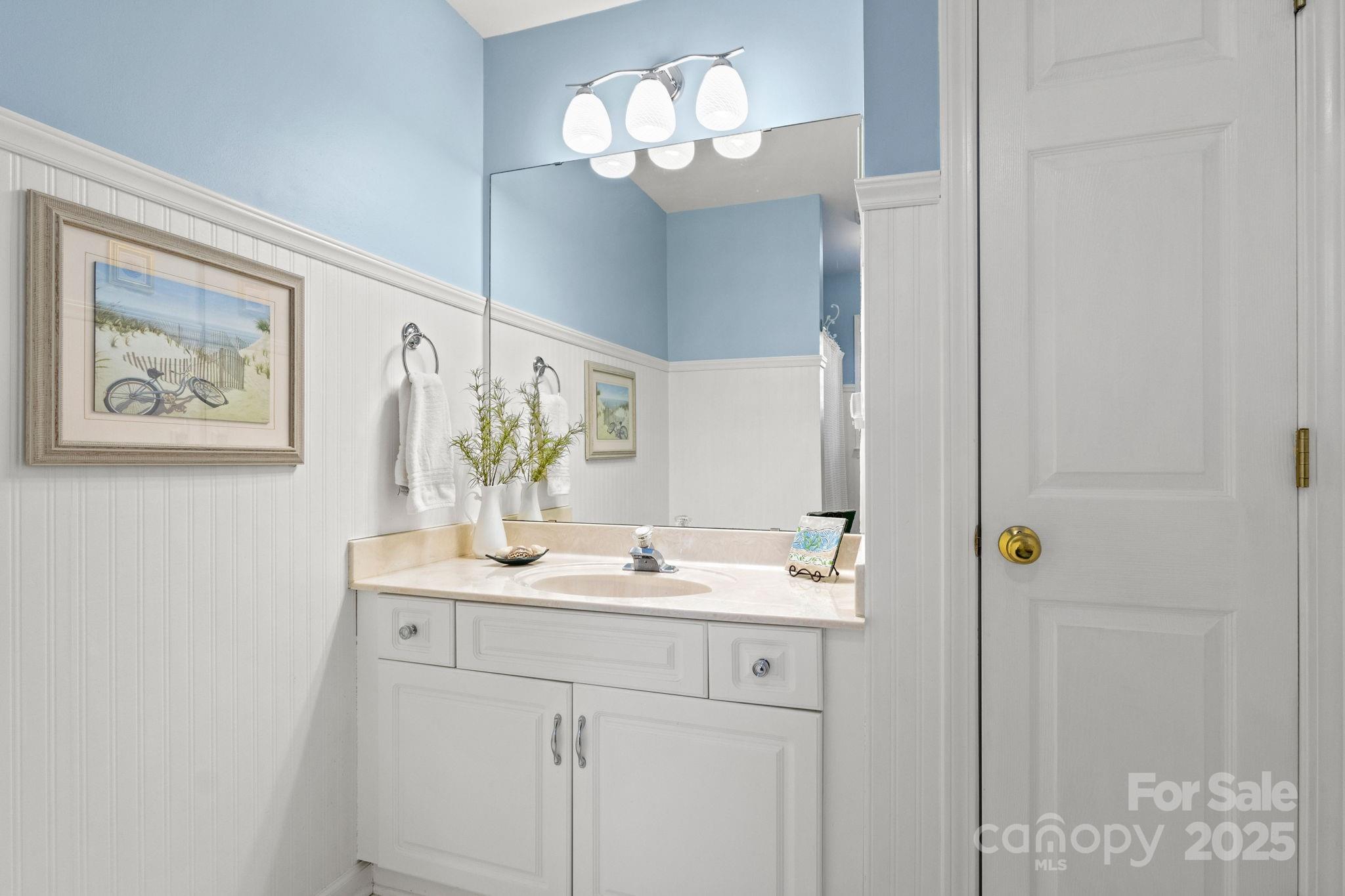 227 Point Wylie Lane Fort Mill, SC 29708 - Photo 28 of 36 a bathroom with a sink and a mirror