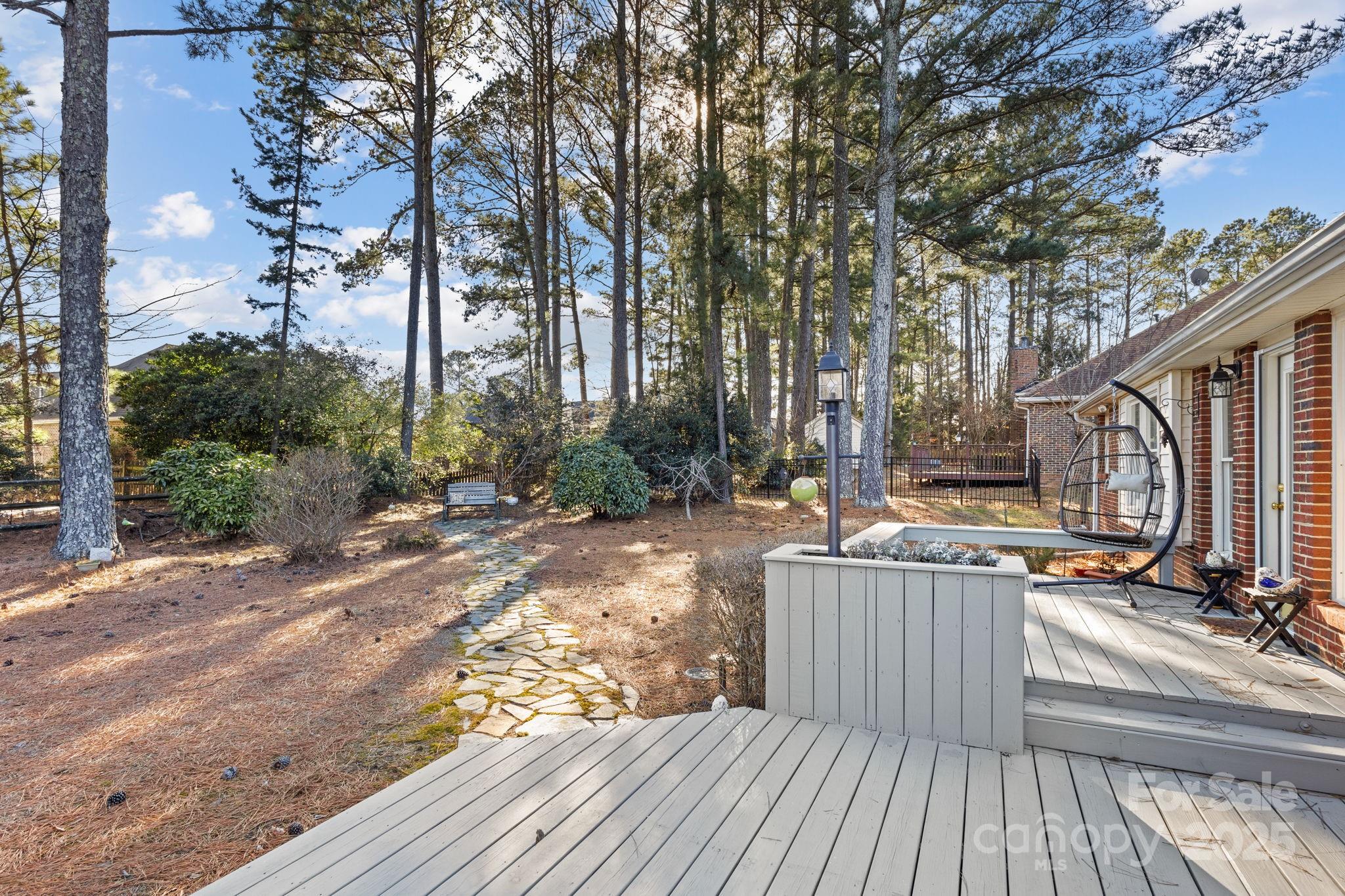 227 Point Wylie Lane Fort Mill, SC 29708 - Photo 32 of 36 a view of a deck with wooden floor and fence