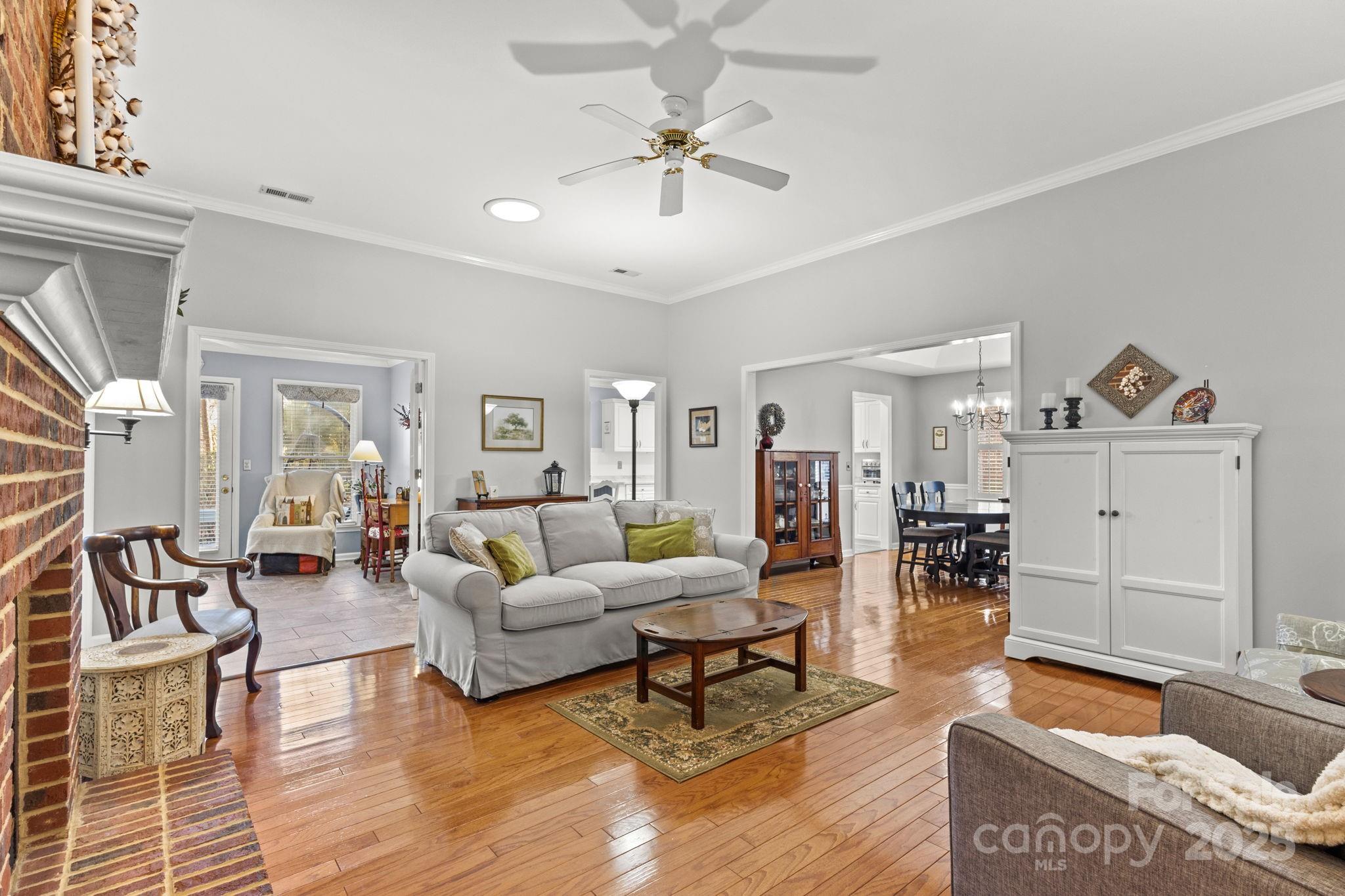 227 Point Wylie Lane Fort Mill, SC 29708 - Photo 4 of 36 a living room with furniture and wooden floor