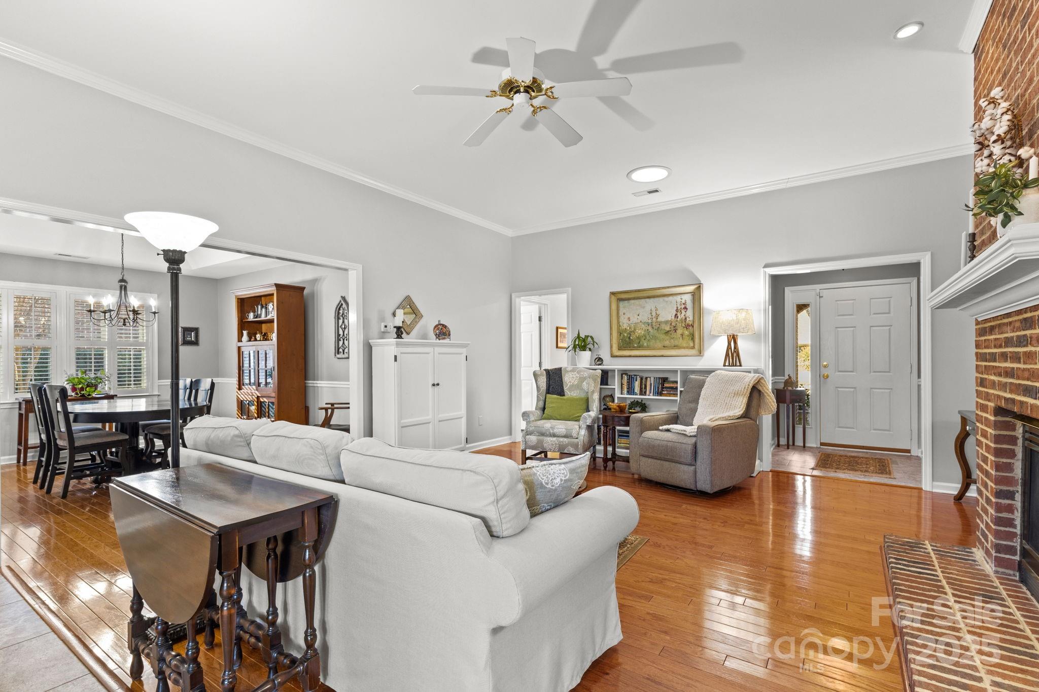 227 Point Wylie Lane Fort Mill, SC 29708 - Photo 5 of 36 a living room with furniture or couch and a chandelier