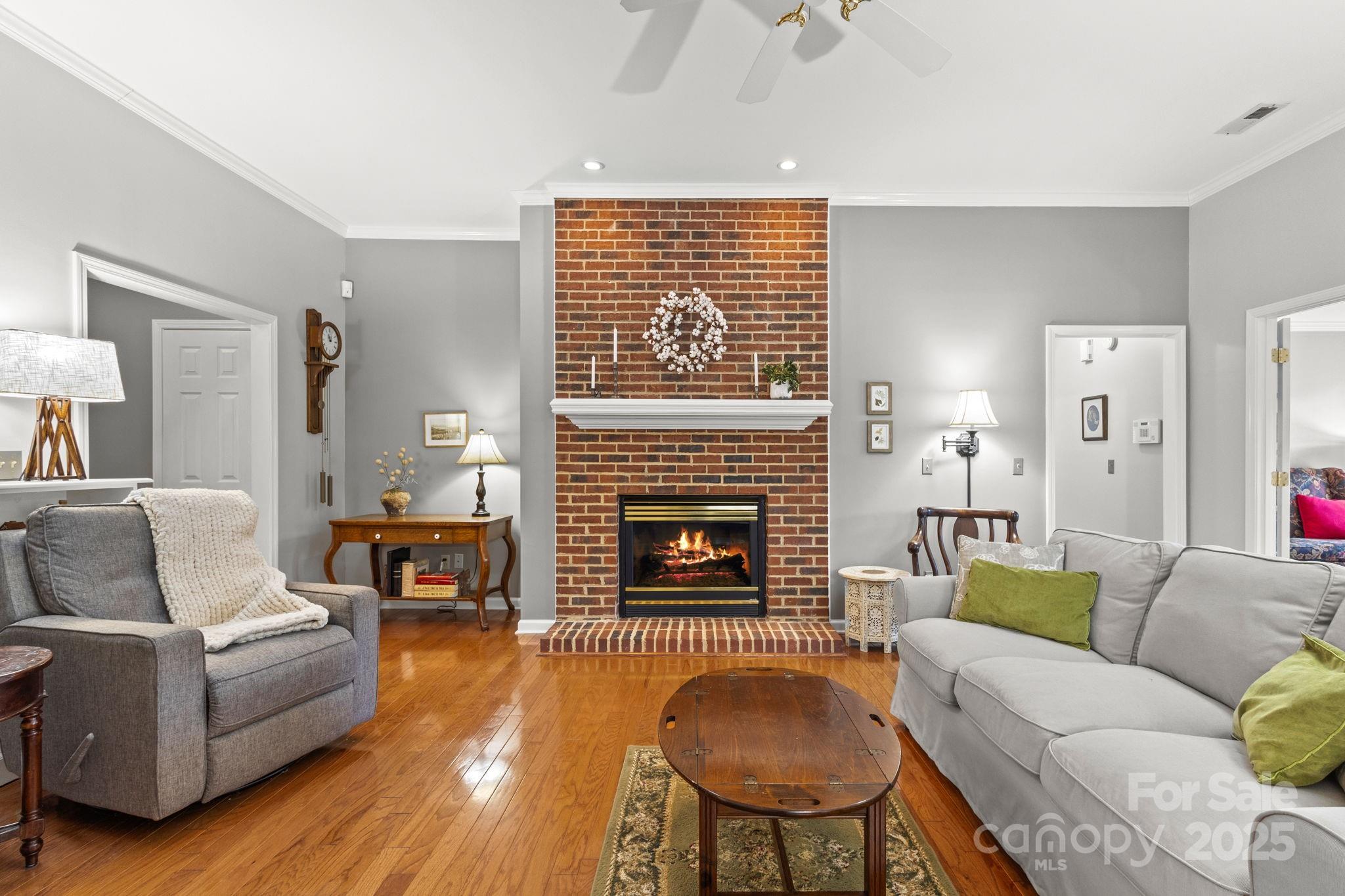 227 Point Wylie Lane Fort Mill, SC 29708 - Photo 6 of 36 a living room with furniture or fireplace and a wooden floor