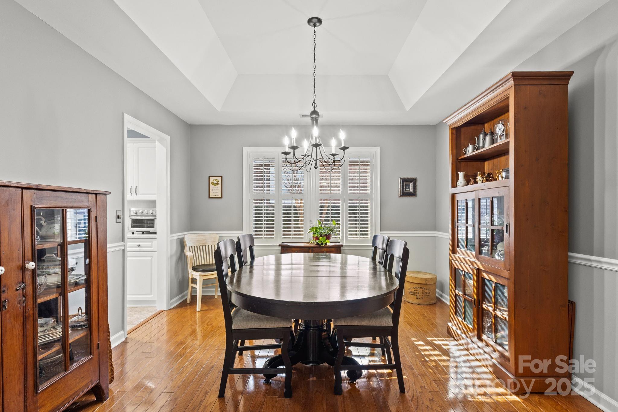227 Point Wylie Lane Fort Mill, SC 29708 - Photo 7 of 36 a view of a dining room with furniture window and wooden floor