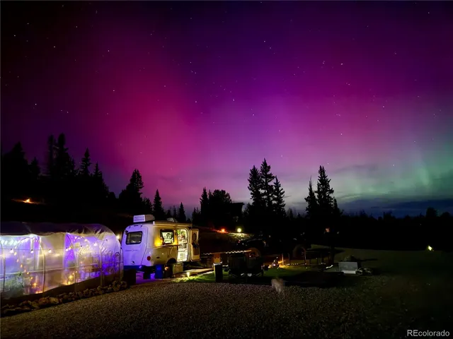 a view of a street with lots of residential buildings