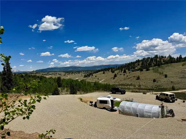 a view of a terrace with yard and outdoor seating