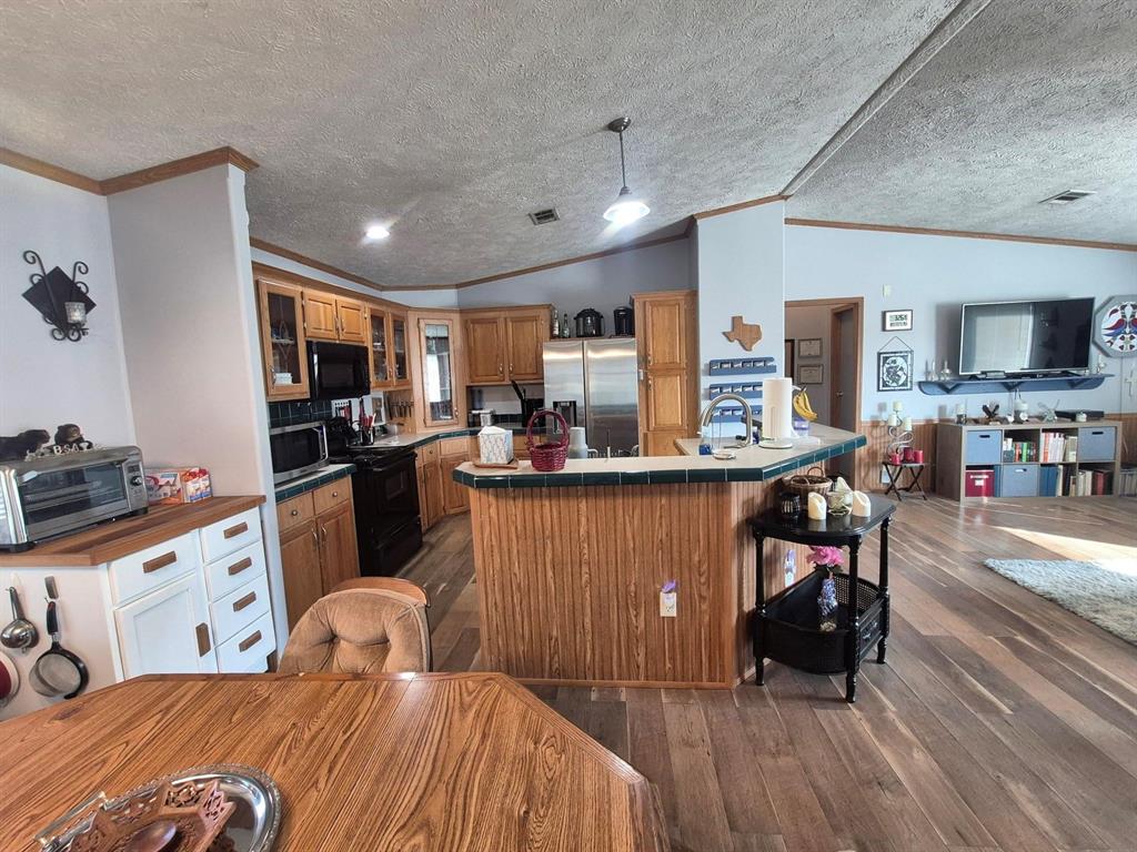 438 Silver River Road Gholson, TX 76705 - Photo 10 of 39 a bed room with a bed and furniture