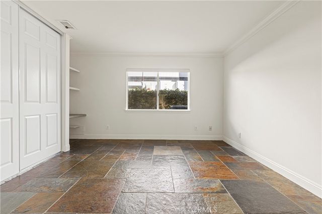 a dining room with furniture a rug and a chandelier