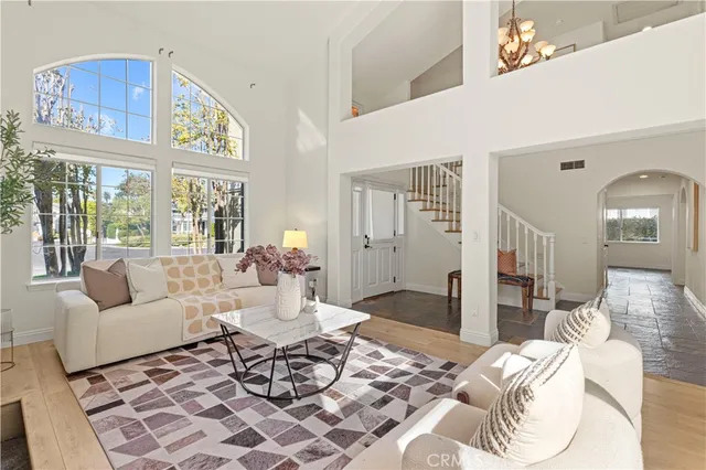 a living room with furniture a fireplace and a table
